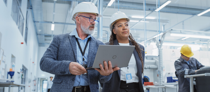 photo of manufacturing leaders walking an assembly line